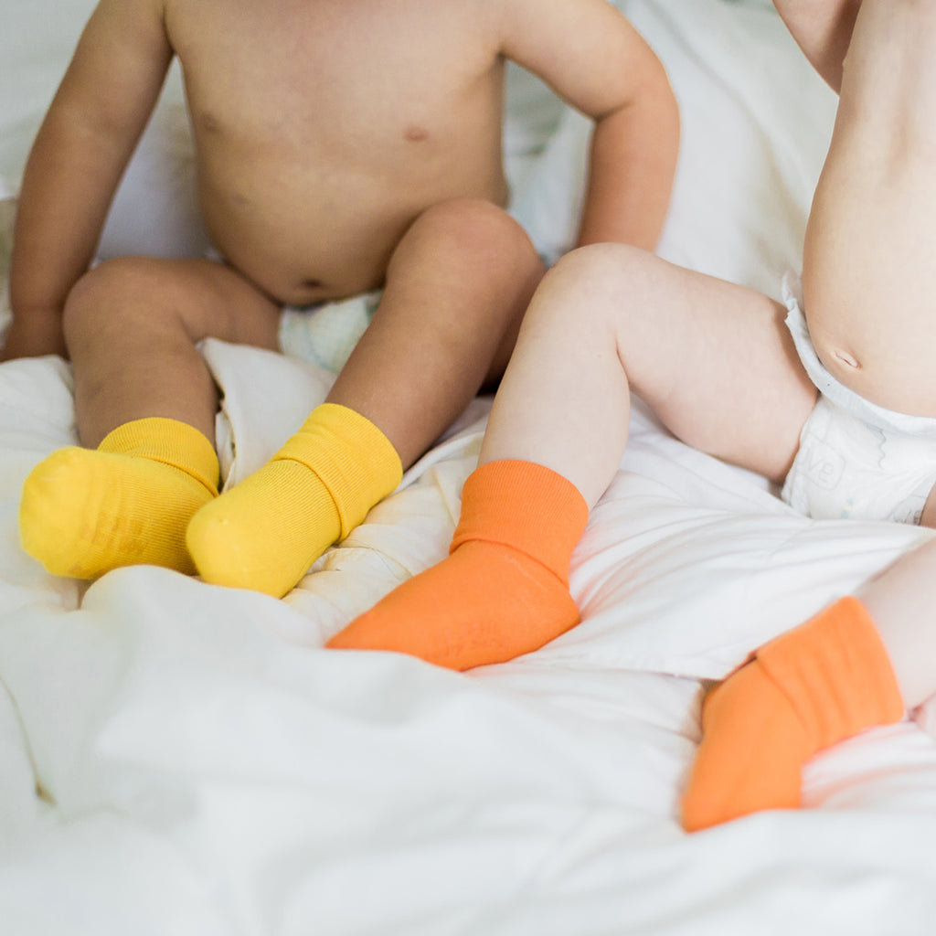 Solid baby socks in orange and yellow